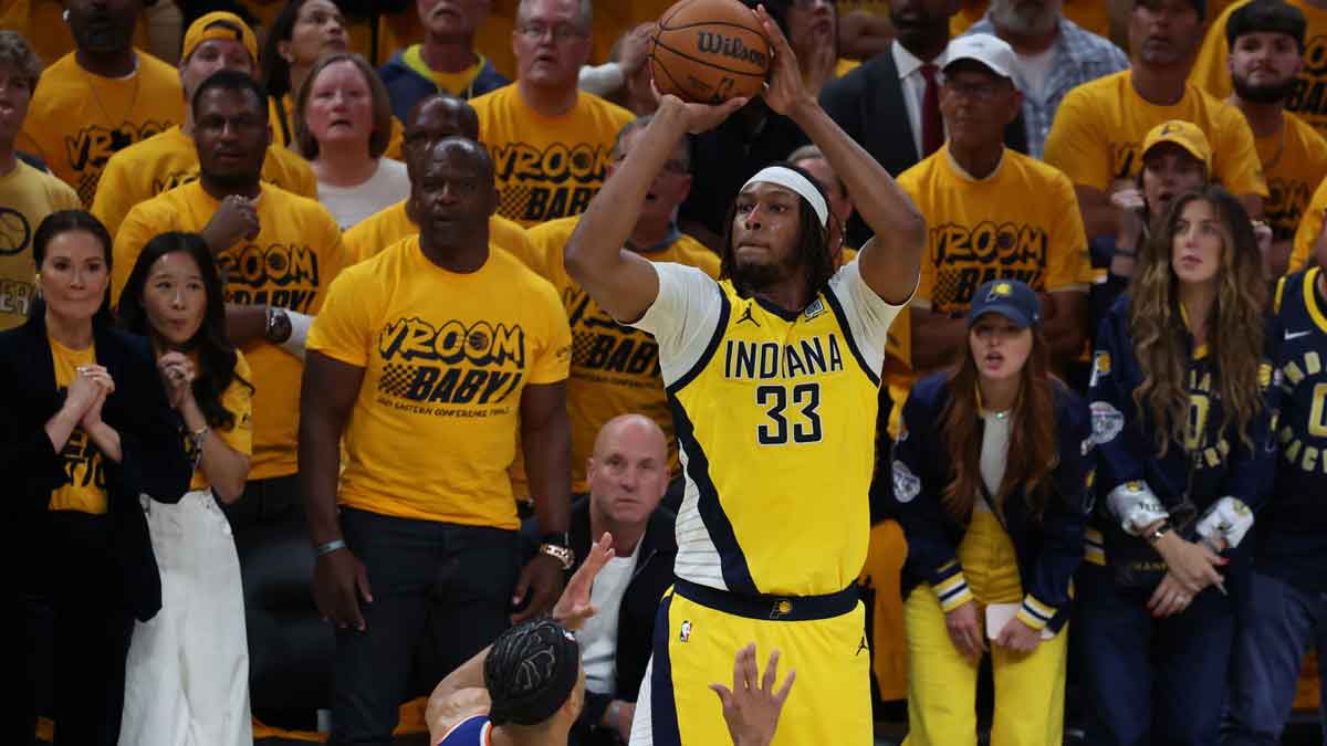 Indiana Pacers center Myles Turner (33) shoots a three point basket over New York Knicks guard Josh Hart (3) during the fourth quarter of game three of the eastern conference finals for the 2025 NBA Playoffs at Gainbridge Fieldhouse.
