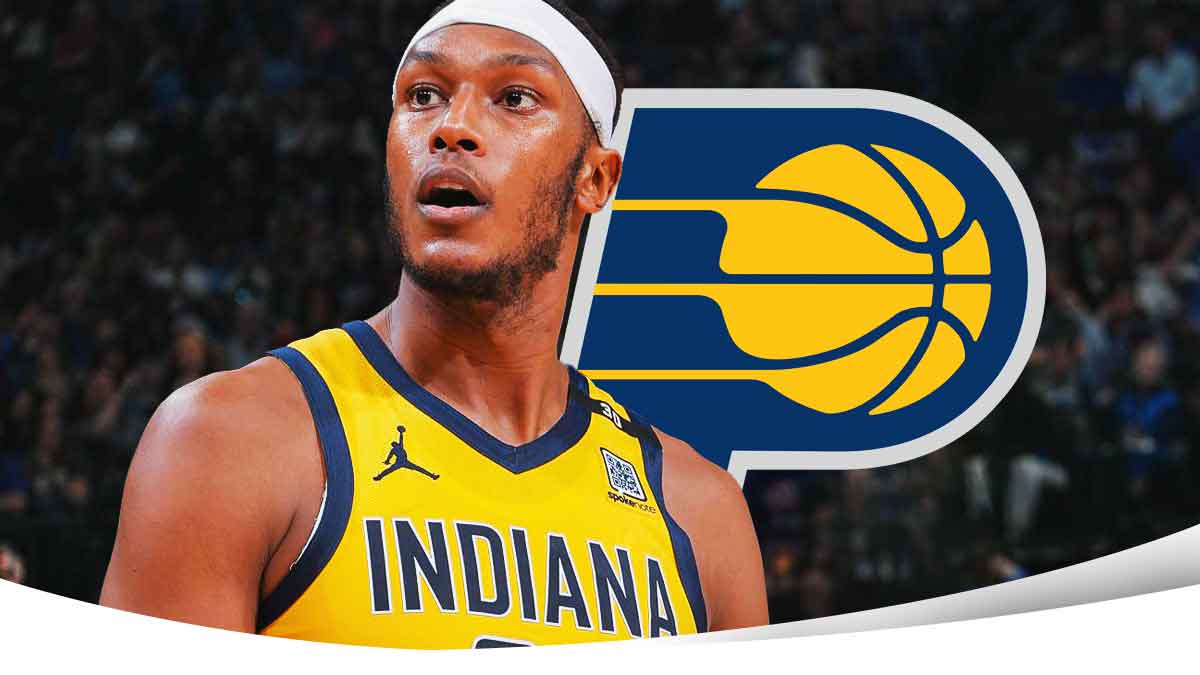 Myles Turner playing for the Pacers. Pacers logo in background