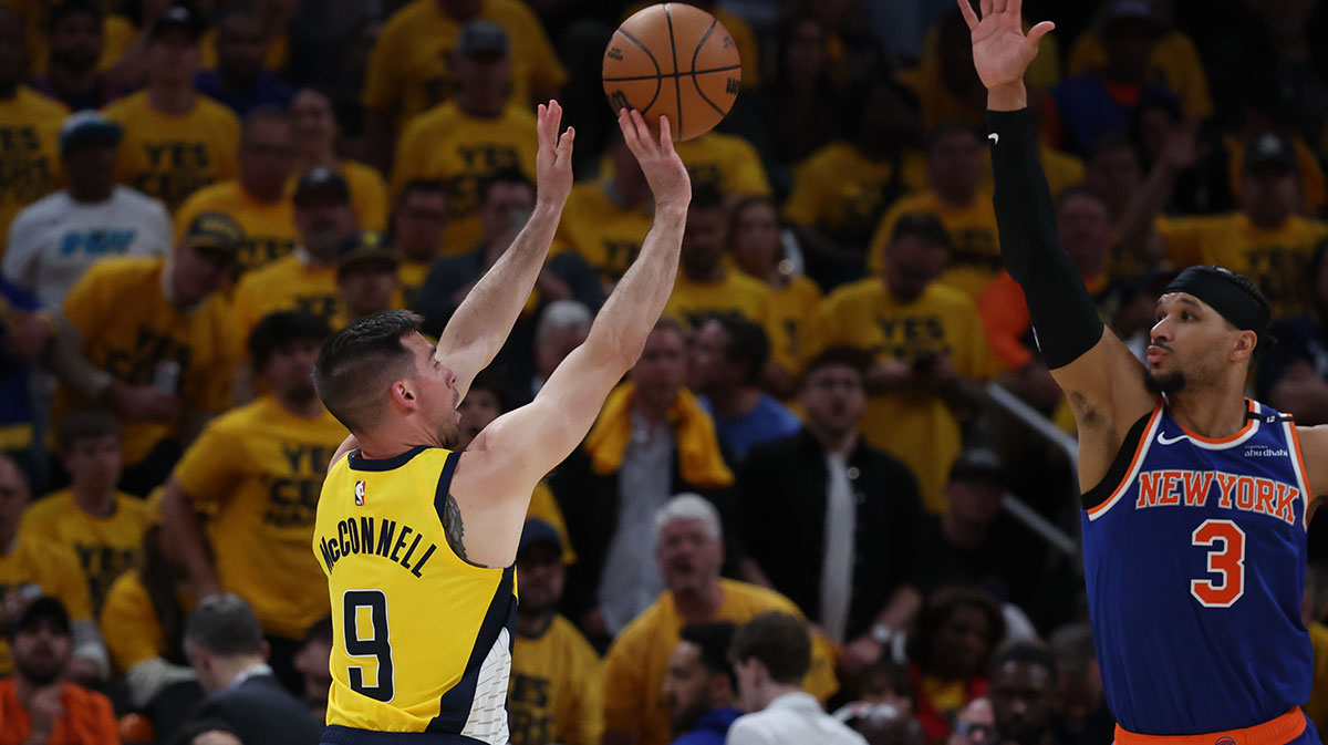 Indiana Pacers guard T.J. McConnell (9) shoots a three point basket over New York Knicks guard Josh Hart (3) during the third quarter of game four of the eastern conference finals for the 2025 NBA Playoffs at Gainbridge Fieldhouse. 