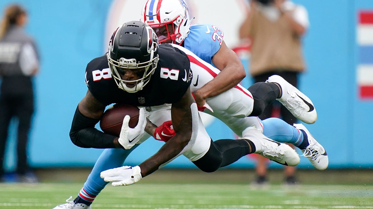 Atlanta Falcons tight end Kyle Pitts (8) is pulled down by Tennessee Titans cornerback Eric Garror (33) during the second quarter at Nissan Stadium in Nashville, Tenn., Sunday, Oct. 29, 2023.