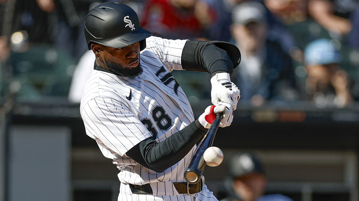 Chicago White Sox center fielder Luis Robert Jr. (88) doubles against the Texas Rangers during the fourth inning at Rate Field.