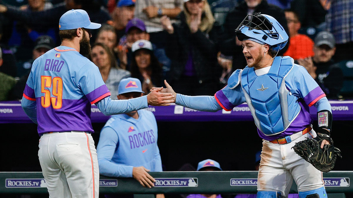 Colorado Rockies relief pitcher Jake Bird (59) reacts with catcher Hunter Goodman (15) in the sixth inning against the New York Mets at Coors Field. MLB trade deadline