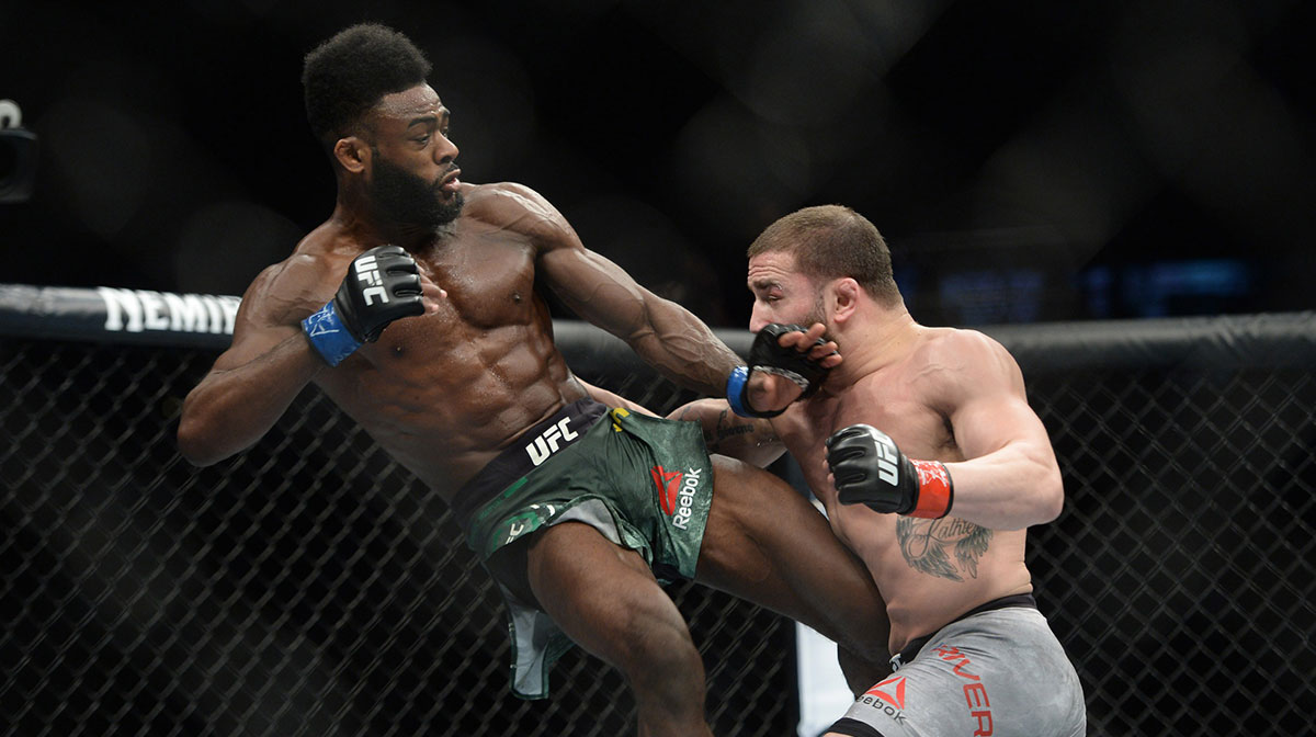 Jimmie Rivera (red gloves) and Aljamain Sterling (blue gloves) fight during their bantamweight bout during UFC Fight Night at Talking Stick Resort Arena. Sterling won via unanimous decision.