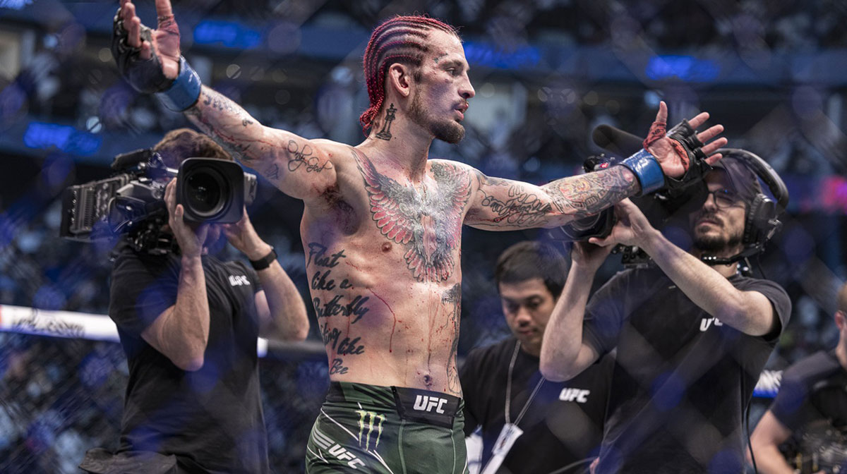 Sean O'Malley (blue gloves) defeats Petr Yan (red gloveS) during UFC 280 at Etihad Arena.