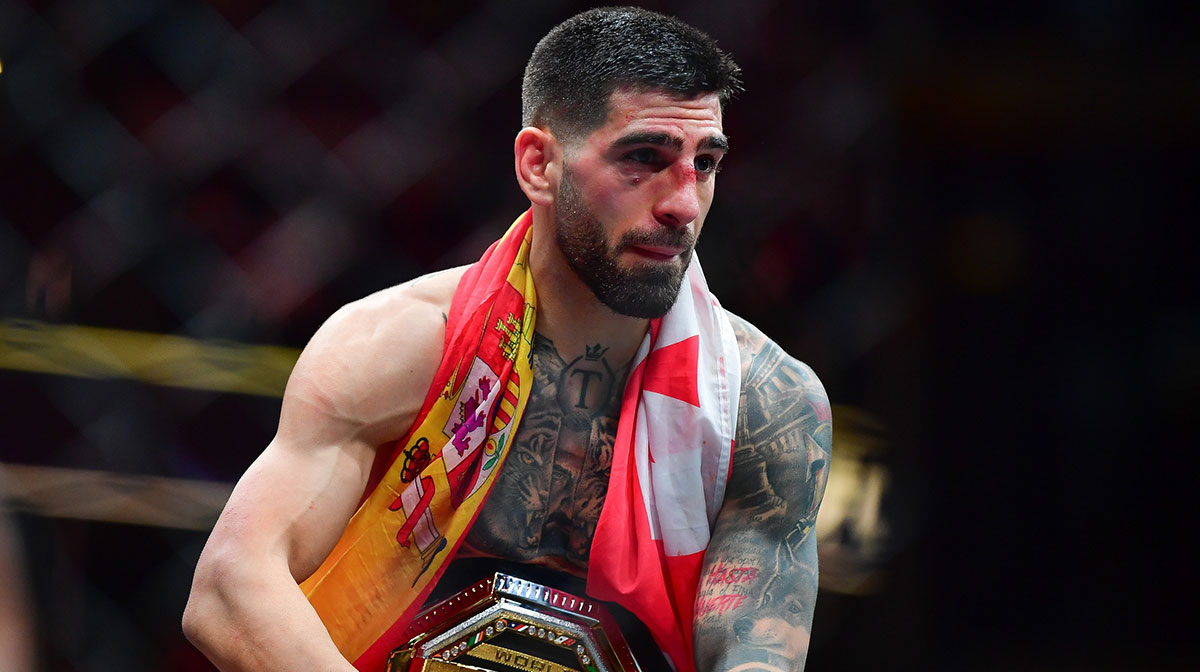 Ilia Topuria celebrates his championship victory against Alexander Volkanovski during UFC 298 at Honda Center.