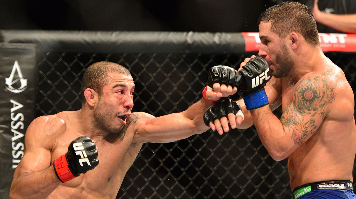 Jose Aldo (red gloves) fights against Chad Mendez (blue gloves) during UFC 179 at Ginasio do Maracanazinho.