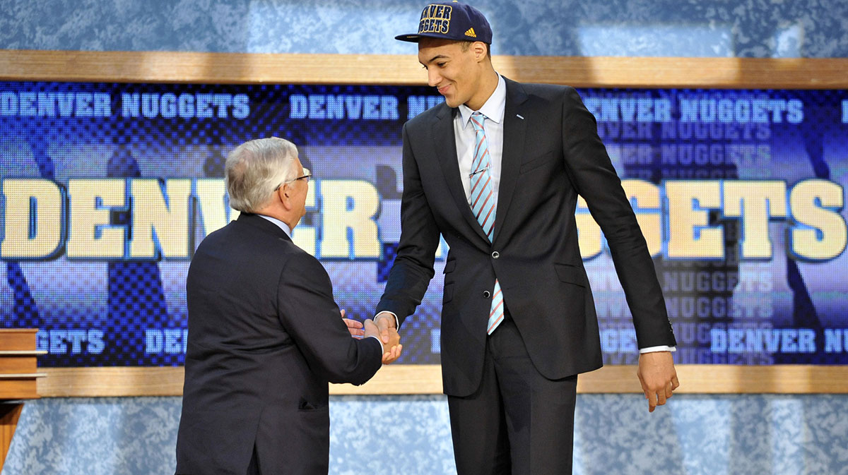 Rudy Gobert shakes hands with NBA commissioner David Stern after being selected as the number twenty-seven overall pick to the Denver Nuggets during the 2013 NBA Draft at the Barclays Center.