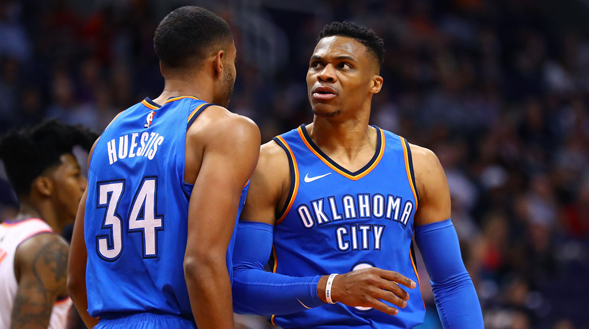 Oklahoma City Thunder guard Russell Westbrook (0) and guard Josh Huestis (34) against the Phoenix Suns at Talking Stick Resort Arena.