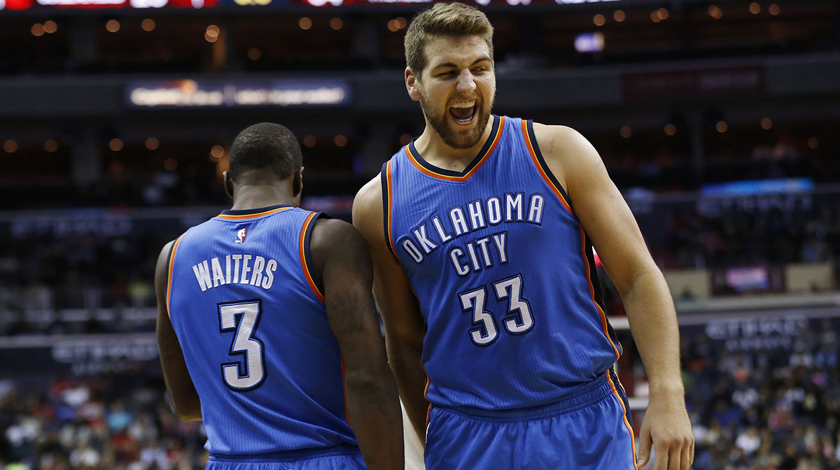 Oklahoma City Thunder forward Mitch McGary (33) celebrates with Thunder guard Dion Waiters (3) against the Washington Wizards in the second quarter at Verizon Center. The Thunder won 125-101.