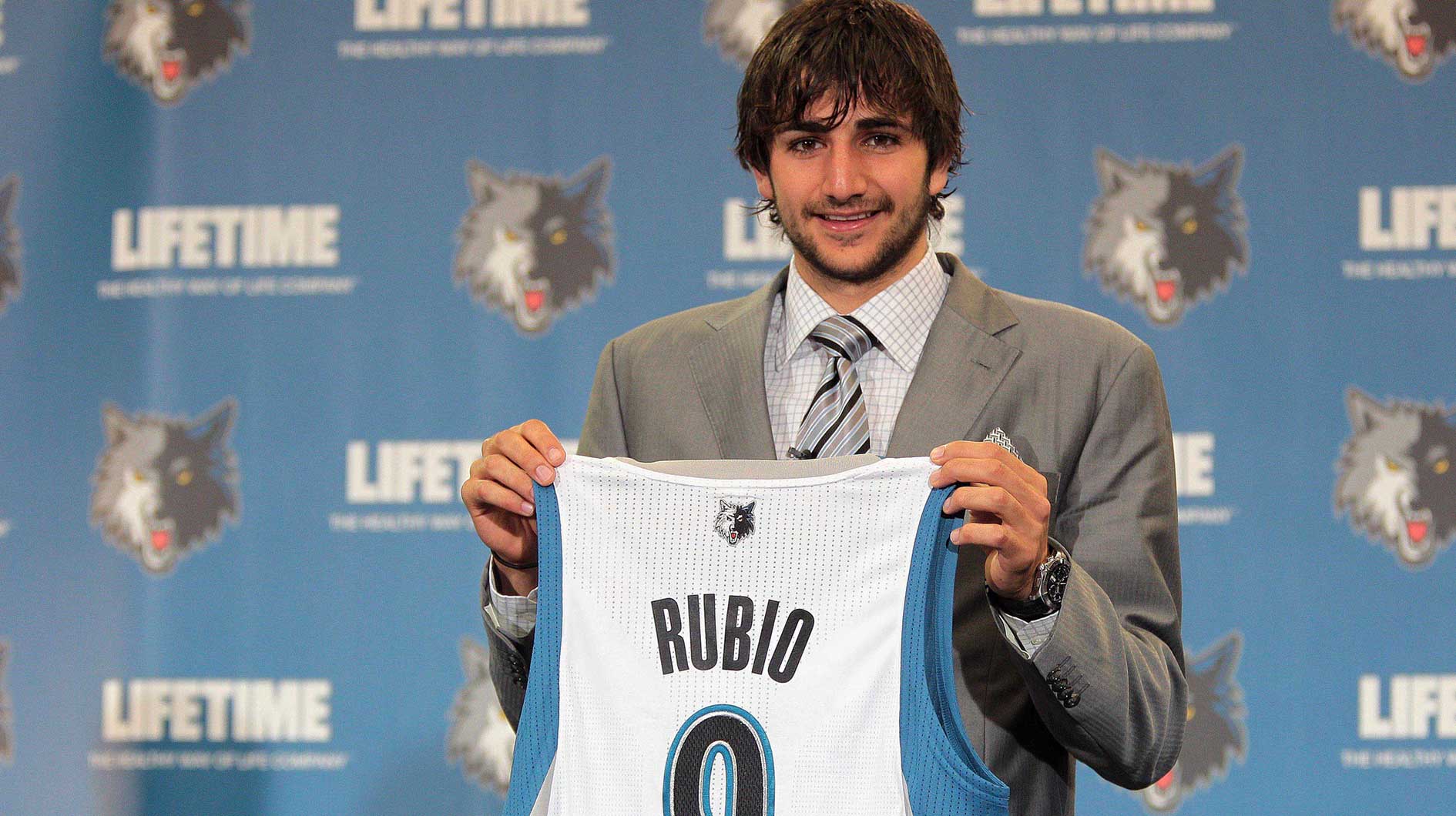 Minnesota Timberwolves draft pick Ricky Rubio holds up his jersey during a press conference at Target Center.