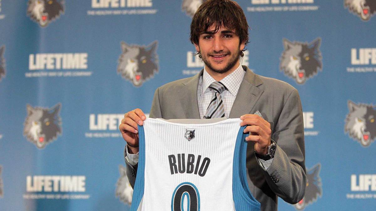 Minnesota Timberwolves draft pick Ricky Rubio holds up his jersey during a press conference at Target Center.