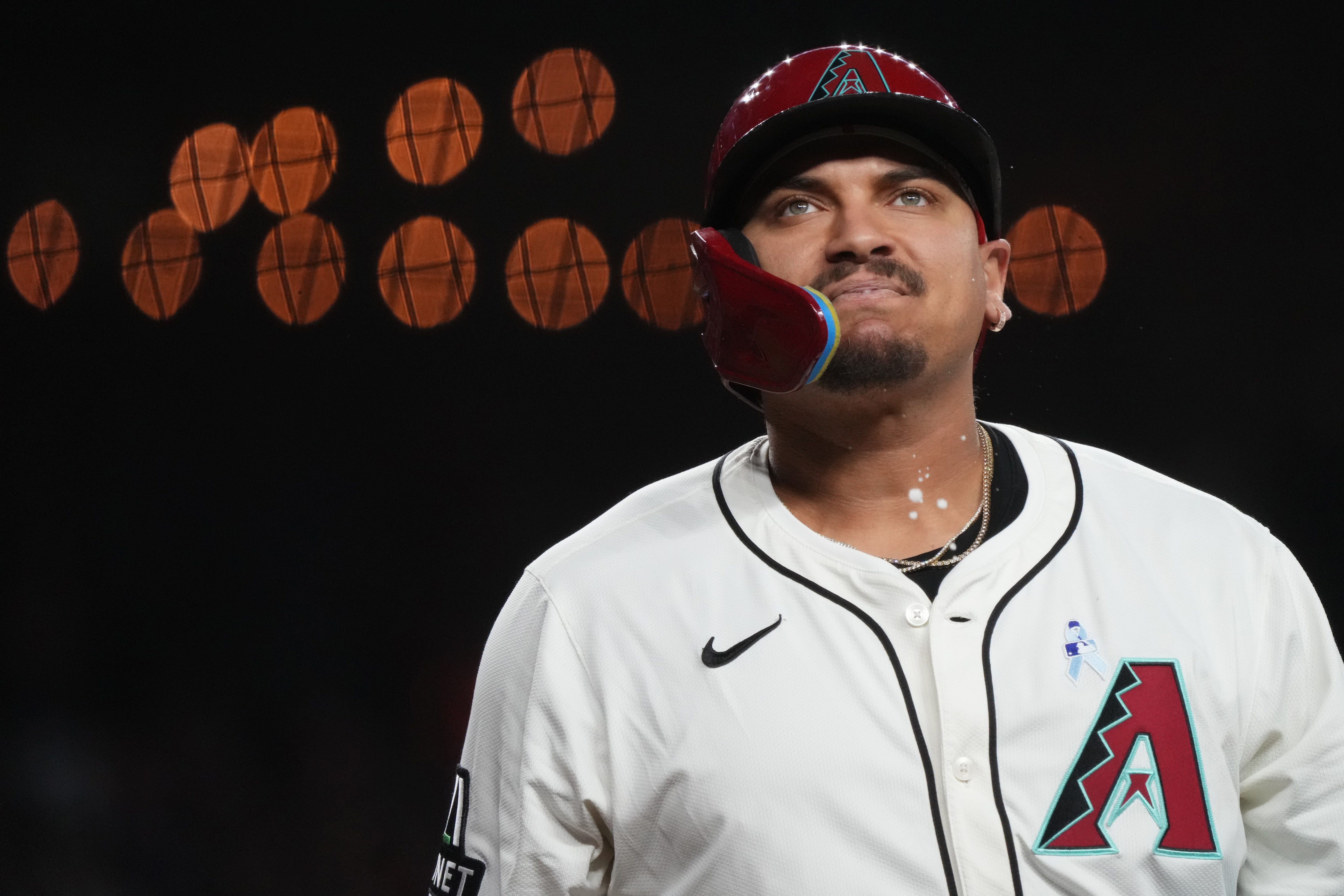 Arizona Diamondbacks Josh Naylor (22) spits as he reacts to fouling off a pitch against the San Diego Padres at Chase Field.