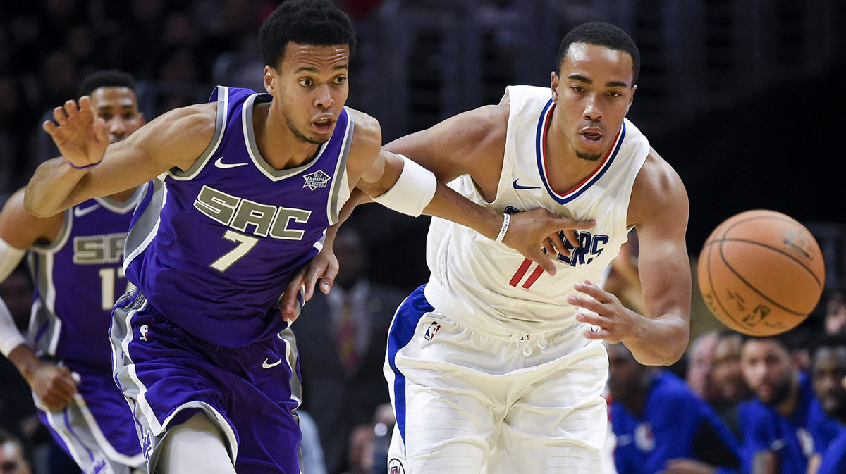 Sacramento Kings forward Skal Labissiere (7) and LA Clippers forward Brice Johnson (11) chase the loose ball during the second quarter at Staples Center.