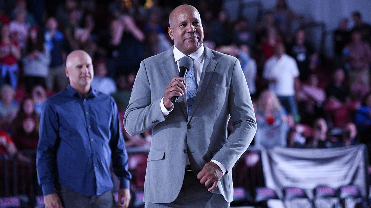 Former Loyola Marymount Lions basketball player Bo Kimble speaks to the crowd while being introduced during halftime for a ceremony at Gersten Pavilion.
