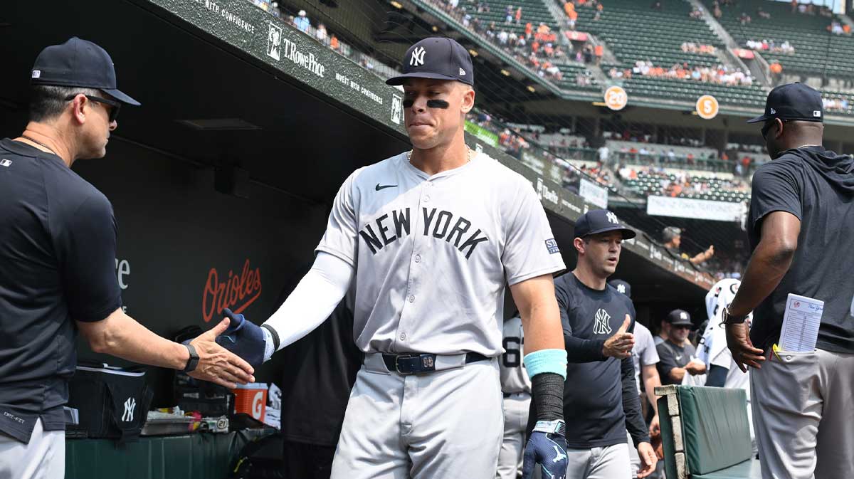 New York Yankees outfielder Aaron Judge (99) greets New York Yankees manager Aaron Boone (17) before the game against the Baltimore Orioles.