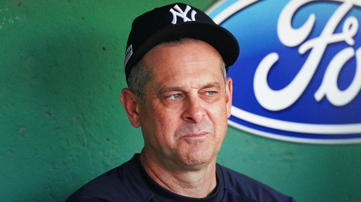 New York Yankees manager Aaron Boone (17) in the dugout before the start of the game against the Boston Red Sox at Fenway Park.