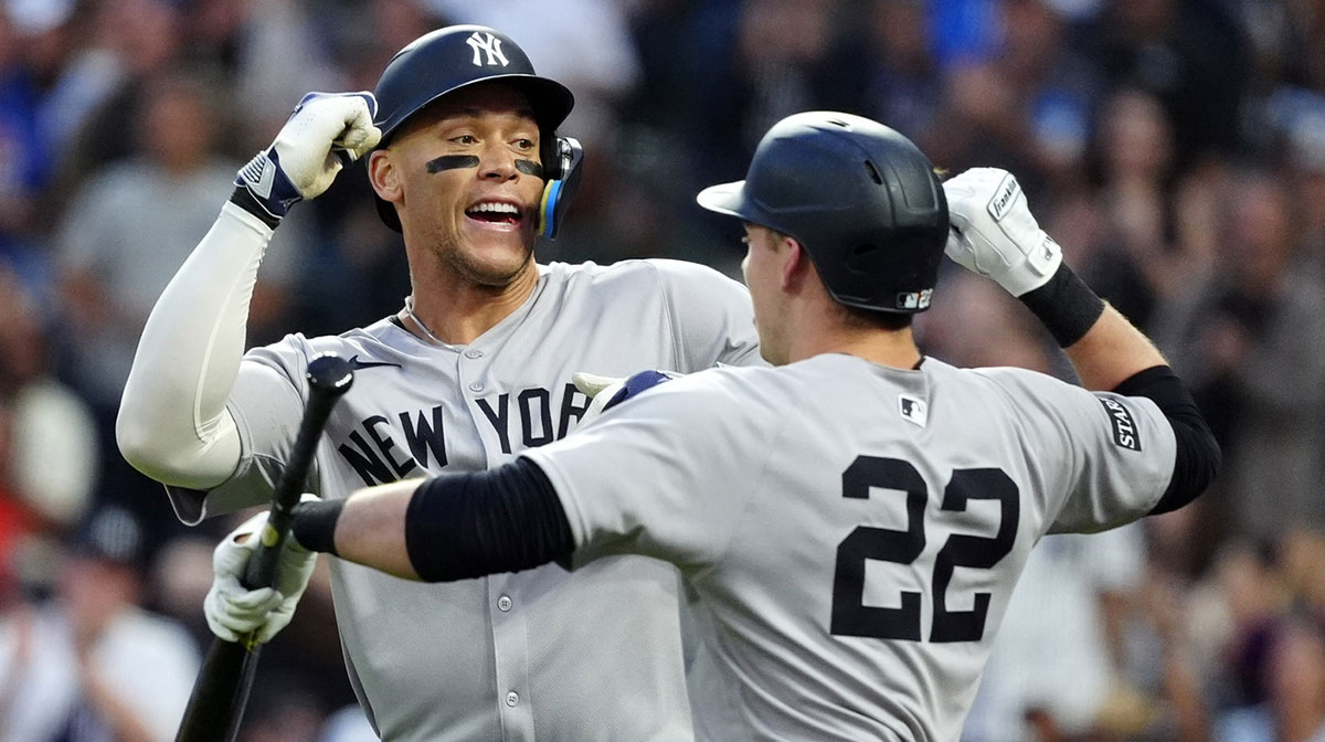 New York Yankees right fielder Aaron Judge (99) celebrates his solo home run with designated hitter Ben Rice (22) in the fifth inning against the Colorado Rockies at Coors Field.