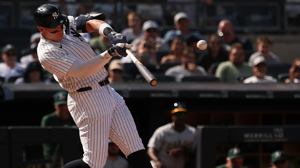 New York Yankees designated hitter Aaron Judge (99) hits a two run home run during the seventh inning against the Athletics at Yankee Stadium.