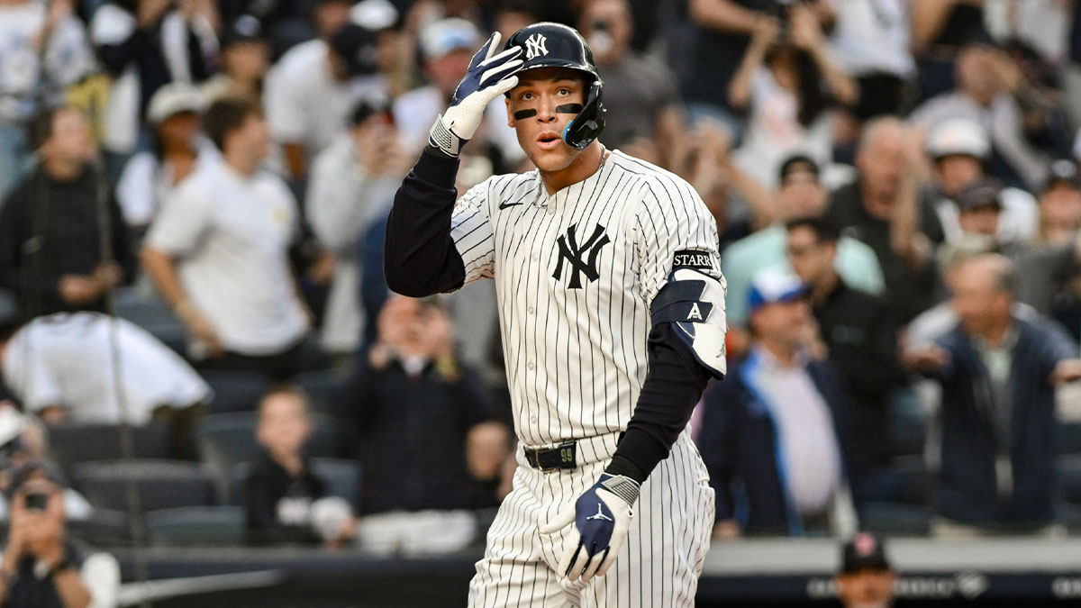 New York Yankees outfielder Aaron Judge (99) reacts after hitting a two-run home run against the Boston red Sox during the first inning at Yankee Stadium.