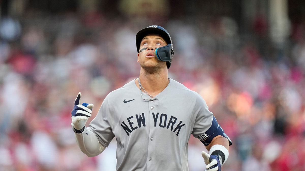 New York Yankees outfielder Aaron Judge (99) crosses the plate on a solo home run in the first inning of the MLB interleague game between the Cincinnati Reds and the New York Yankees at Great American Ball Park in downtown Cincinnati on Monday, June 23, 2025.
