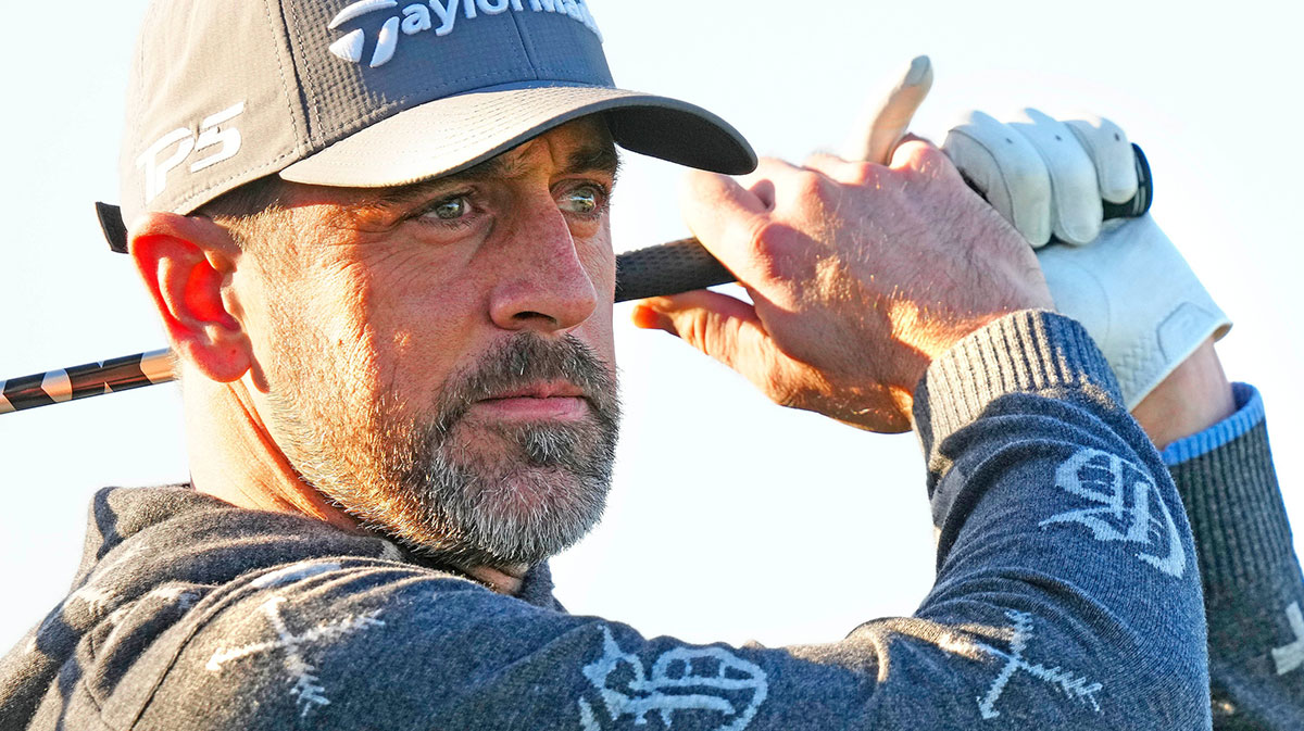 New York Jets quarterback Aaron Rodgers tees off on the first hole during the Phoenix Open Annexus Pro-Am at TPC Scottsdale.