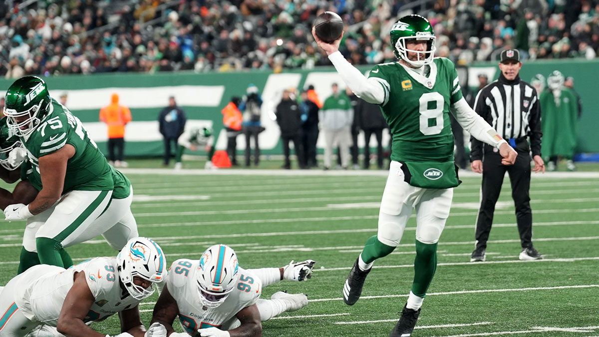 New York Jets quarterback Aaron Rodgers (8) throws his 500th career touchdown pass in the second quarter of the game against the Miami Dolphins on Jan. 5, 2025, in East Rutherford, N.J.