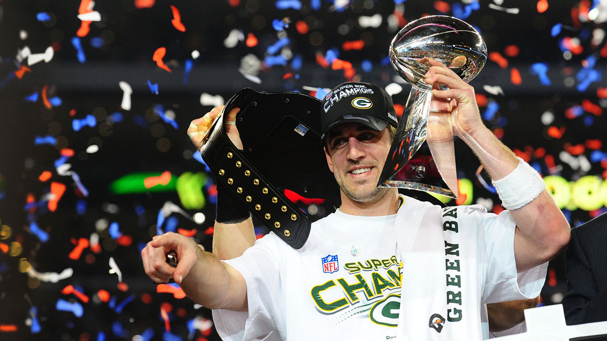 Feb 6, 2011; Arlington, TX, USA; Green Bay Packers quarterback Aaron Rodgers celebrates with the Vince Lombardi trophy after the Packers defeated the Pittsburgh Steelers in Super Bowl XLV at Cowboys Stadium. Mandatory Credit: Mark J. Rebilas-Imagn Images