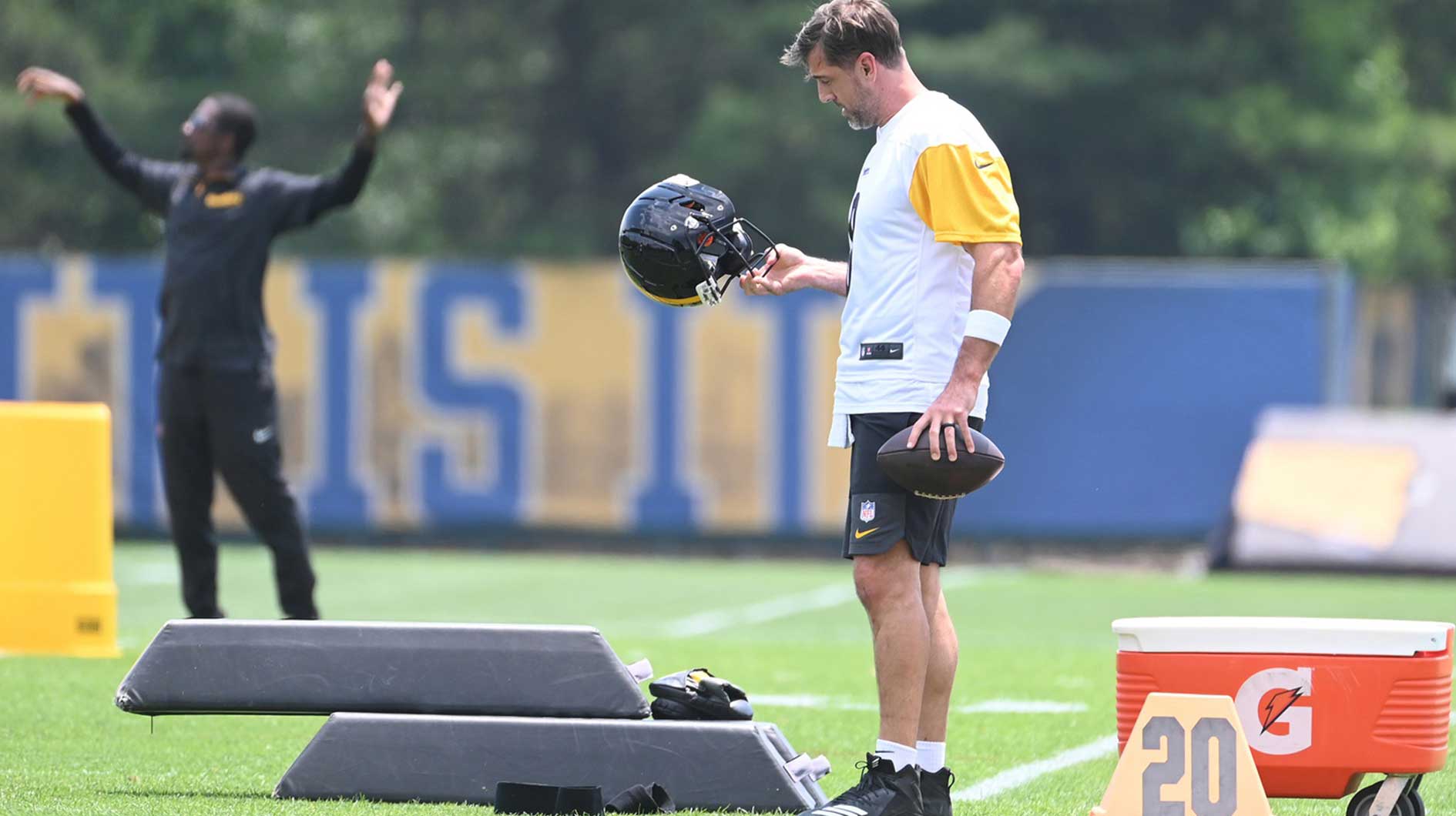 Pittsburgh Steelers quarterback Aaron Rodgers (8) looks over his helmet during minicamp at their South Side facility.