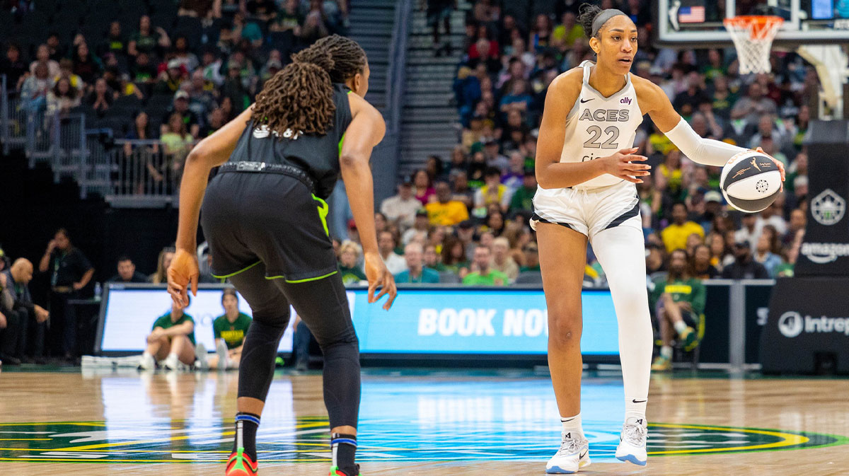Las Vegas Aces center A'ja Wilson (22) takes the ball down the court with Seattle Storm forward Nneka Ogwumike (3) on defense in the fourth period at Climate Pledge Arena.