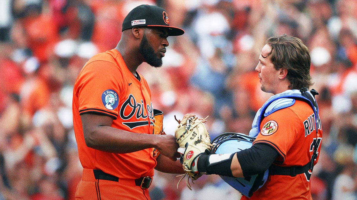 Baltimore Orioles pitcher Felix Bautista (74) and Baltimore Orioles catcher Adley Rutschman (35) celebrate after a game against the Los Angeles Angels at Oriole Park at Camden Yards.