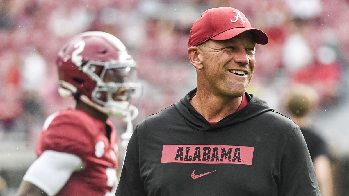 Alabama Crimson Tide head coach Kalen DeBoer watches his team warm up before a game against the Western Kentucky Hilltoppers at Bryant-Denny Stadium. The game will be the first with DeBoer as head coach of the Crimson Tide.