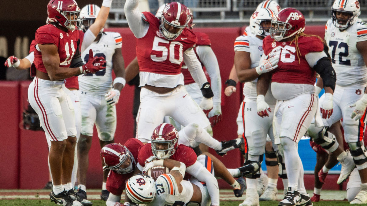 Auburn Tigers running back Jarquez Hunter (27) is stopped during an Alabama Crimson Tide goal line stand at the end of the first half as Auburn Tigers take on Alabama Crimson Tide at Bryant-Denny Stadium in Tuscaloosa, Ala., on Saturday, Nov. 30, 2024. Alabama Crimson Tide leads Auburn Tigers 14-6 at halftime.