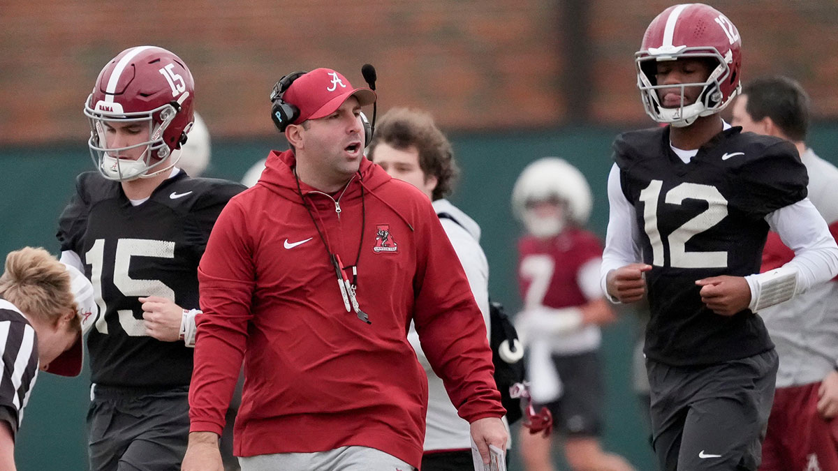 Mar 5, 2025; Tuscaloosa, AL, USA; Quarterbacks coach Nick Seridan walks between quarterbacks Ty Simpson (15) and Keelon Russell (12)during Spring Practice for the Crimson Tide.