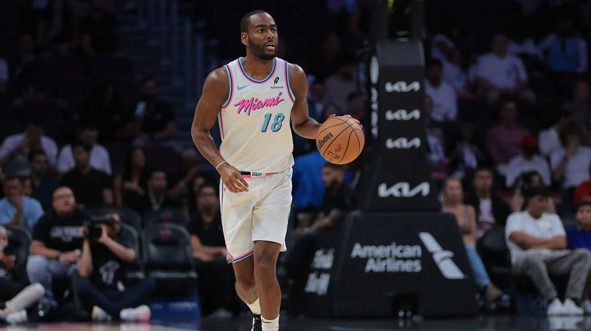 Miami Heat guard Alec Burks (18) dribbles the basketball against the Philadelphia 76ers during the first quarter at Kaseya Center.