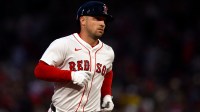 Boston Red Sox third baseman Alex Bregman (2) runs the bases after hitting a solo home run against the Texas Rangers during the fourth inning at Fenway Park.