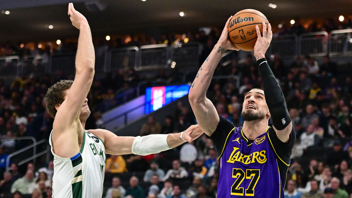 Los Angeles Lakers center Alex Len (27) takes a shot against Milwaukee Bucks center Brook Lopez (11) in the third quarter at Fiserv Forum.