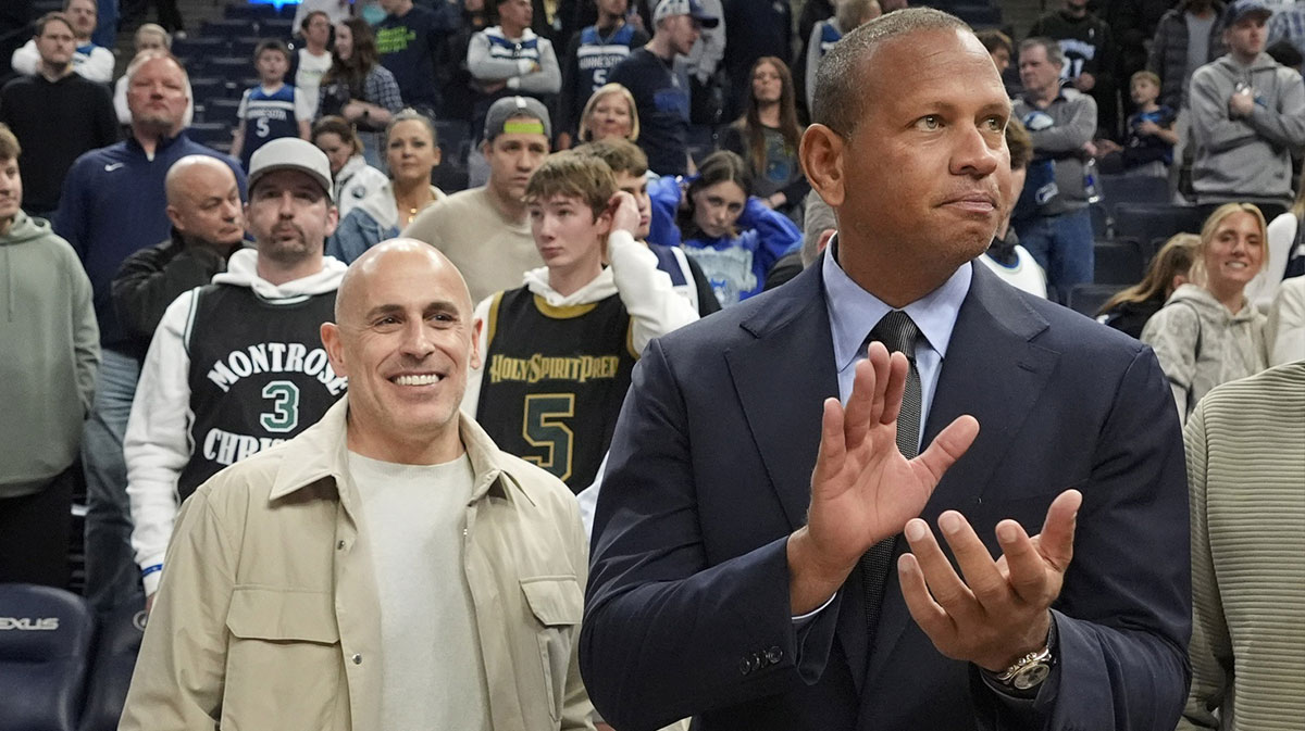 Minnesota Timberwolves minority owners Marc Lore and Alex Rodriguez celebrate the team's win over the Phoenix Suns at Target Center.