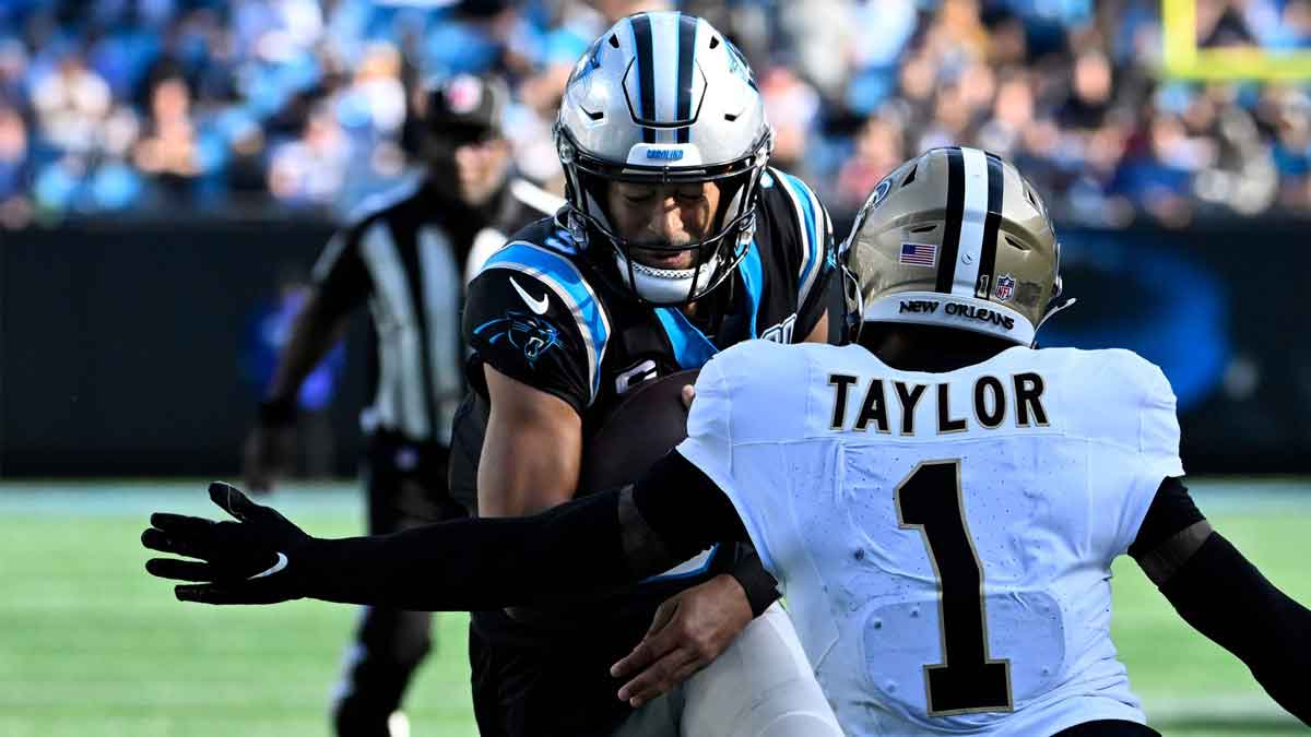 Carolina Panthers quarterback Bryce Young (9) runs with the ball as New Orleans Saints cornerback Alontae Taylor (1) defends in the third qarter at Bank of America Stadium.