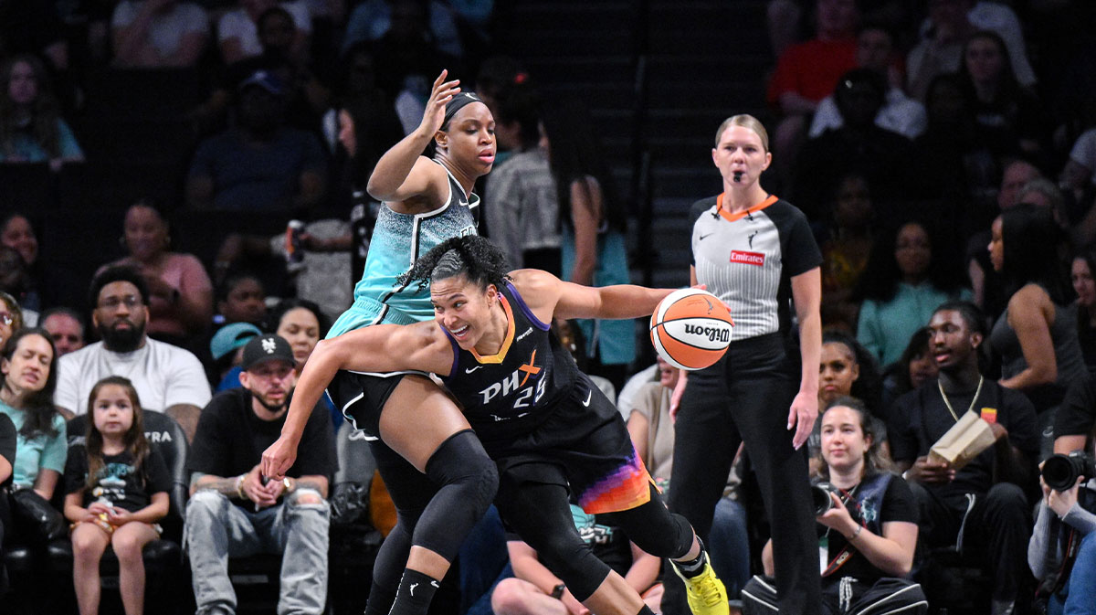 Phoenix Mercury forward Alyssa Thomas (25) drives past New York Liberty forward Kennedy Burke (22) during the first half at Barclays Center.