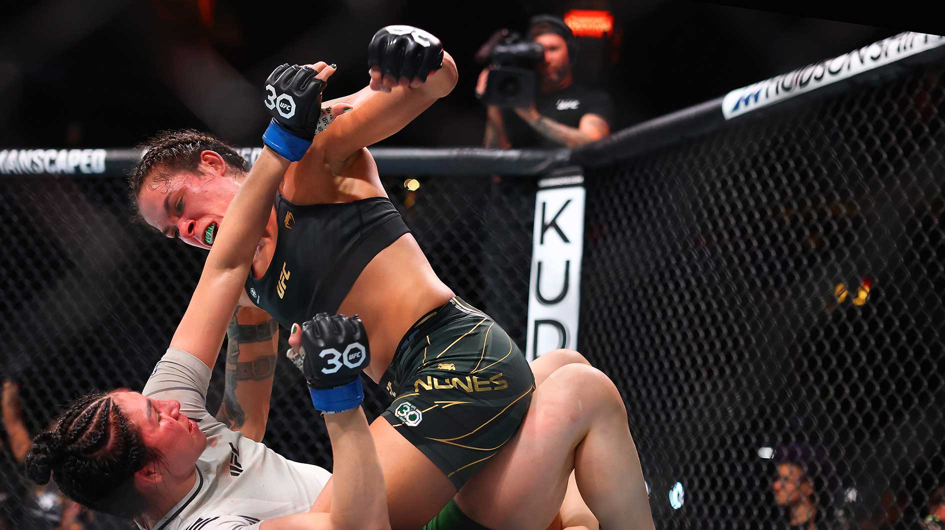 Amanda Nunes moves in for a hit against Irene Aldana during UFC 289 at Rogers Arena.