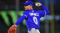 Toronto Blue Jays second baseman Andres Gimenez (0) throws to first for the out against Los Angeles Angels second baseman Luis Rengifo (2) during the fourth inning at Angel Stadium.