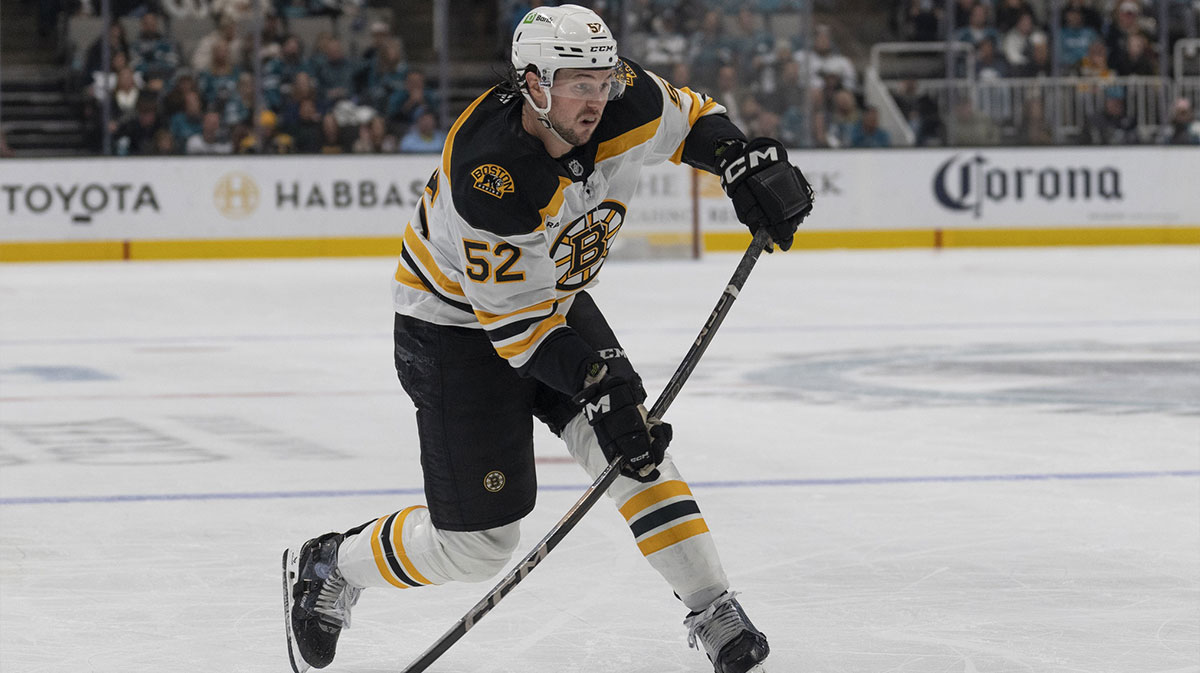 Boston Bruins defenseman Andrew Peeke (52) shoots the puck during the third period against the San Jose Sharks at SAP Center at San Jose.