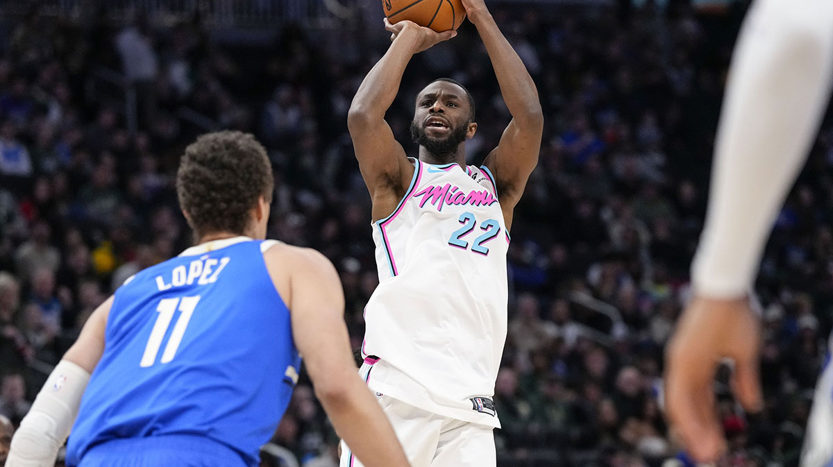Miami Heat forward Andrew Wiggins (22) shoots over Milwaukee Bucks center Brook Lopez (11) during the third quarter at Fiserv Forum.