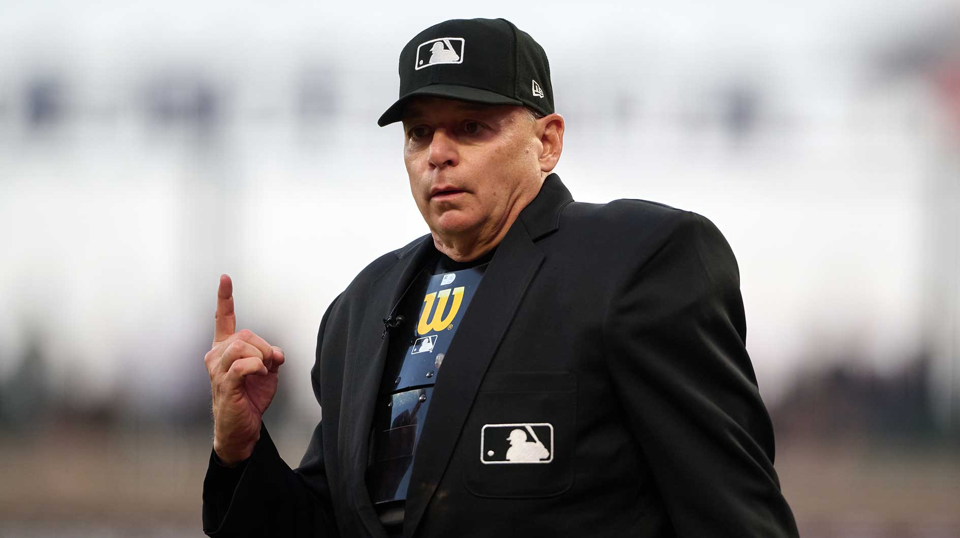 Home plate umpire Andy Fletcher (49) gestures toward the against the San Francisco Giants dugout during the third inning of the game against the Atlanta Braves at Oracle Park.