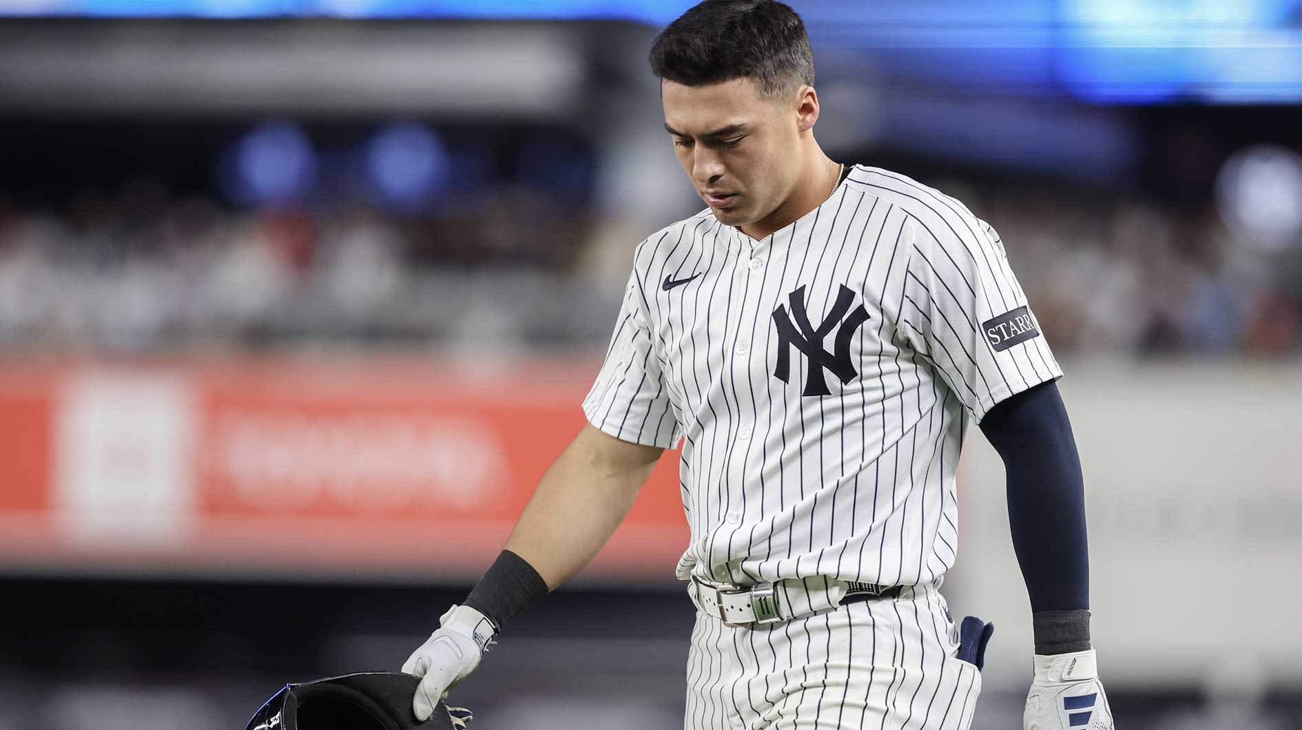 Jun 4, 2025; Bronx, New York, USA; New York Yankees shortstop Anthony Volpe (11) walks back to the field after hitting into an inning ending double play in the seventh inning against the Cleveland Guardians at Yankee Stadium. Mandatory Credit: Wendell Cruz-Imagn Images