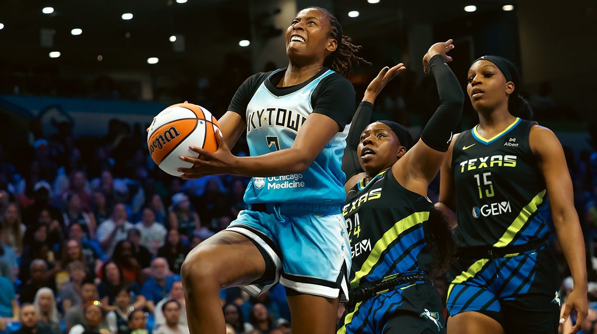 Chicago Sky guard Ariel Atkins (7) scores a layup ahead of Dallas Wings guard Arike Ogunbowale (24) during the first half at College Park Center.