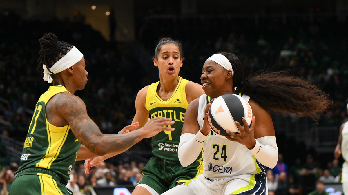 Dallas Wings guard Arike Ogunbowale (24) drives the ball towards the basket while guarded by Seattle Storm guard Erica Wheeler (17) during the second half at Climate Pledge Arena.