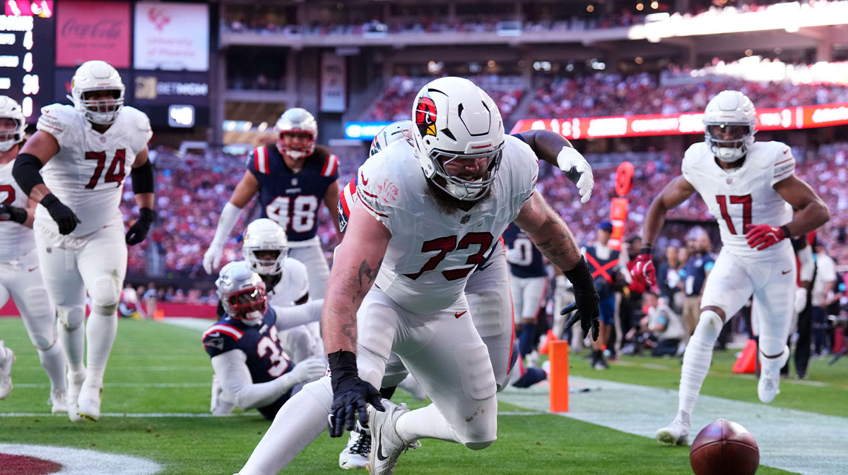 Arizona Cardinals offensive tackle Jonah Williams (73) dives on a fumble for a touchdown during the first half at State Farm Stadium.
