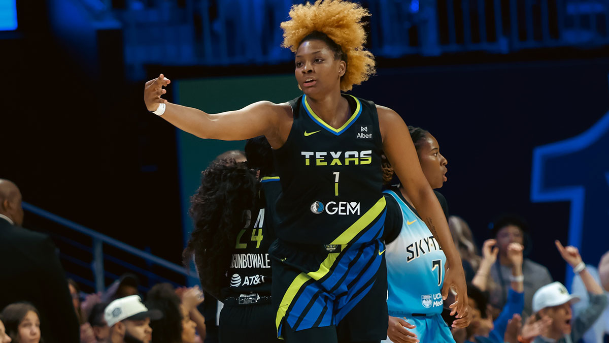 May 31, 2025; Arlington, Texas, USA; Dallas Wings forward NaLyssa Smith (1) reacts after scoring a three-point basket against the Chicago Sky during the first half at College Park Center. Mandatory Credit: Chris Jones-Imagn Images
