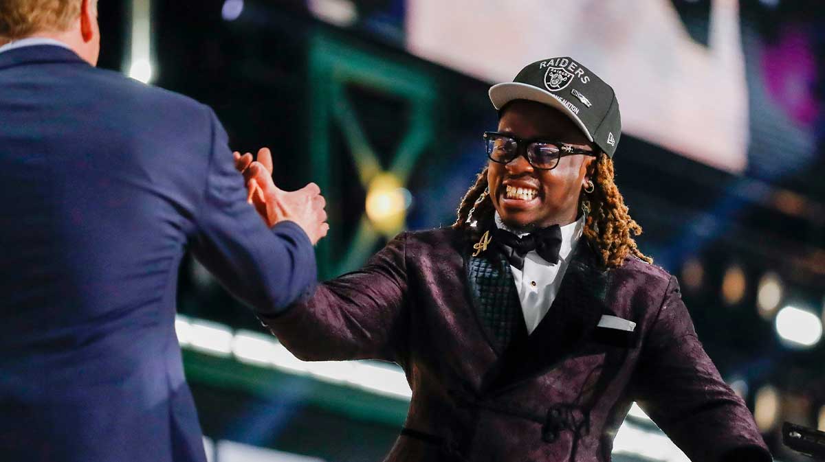 Running back Ashton Jeanty slaps hands with NFL Commissioner Roger Goodell after being selected sixth overall by the Las Vegas Raiders during the first round of the 2025 NFL Draft.